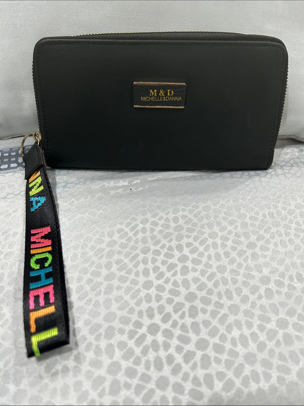 Michelle & Danna Black Wristlet Clutch with Colorful Logo Strap